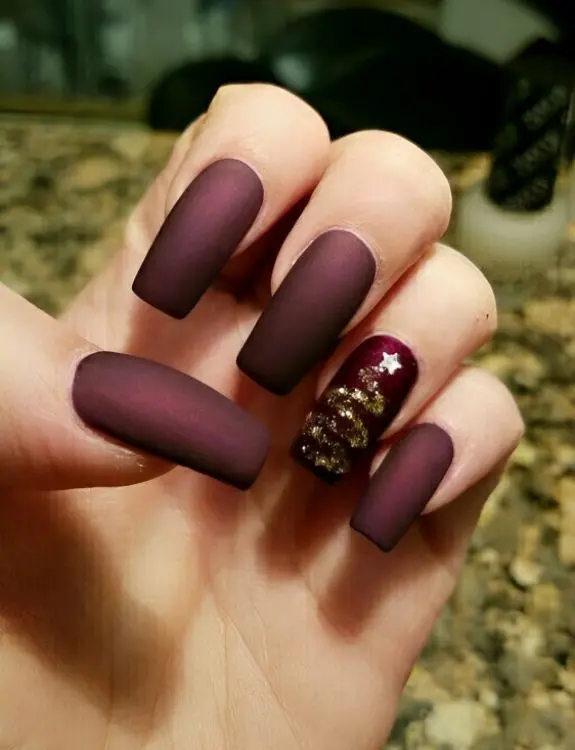 glitter over a matte burgundy base nails