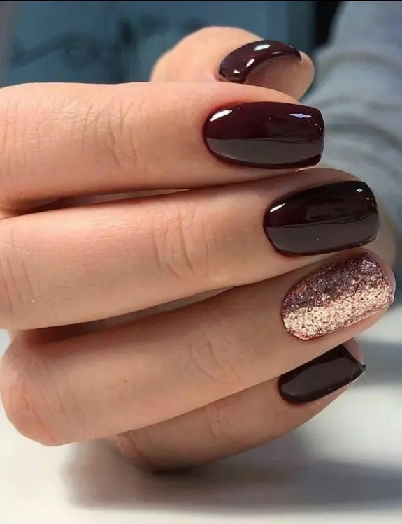 burgundy nails with charming golden accents