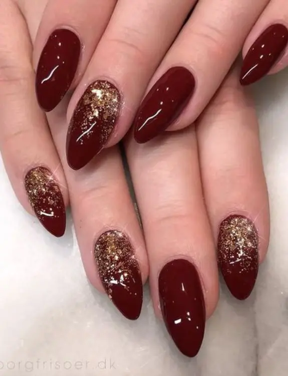 burgundy nails with charming golden accents